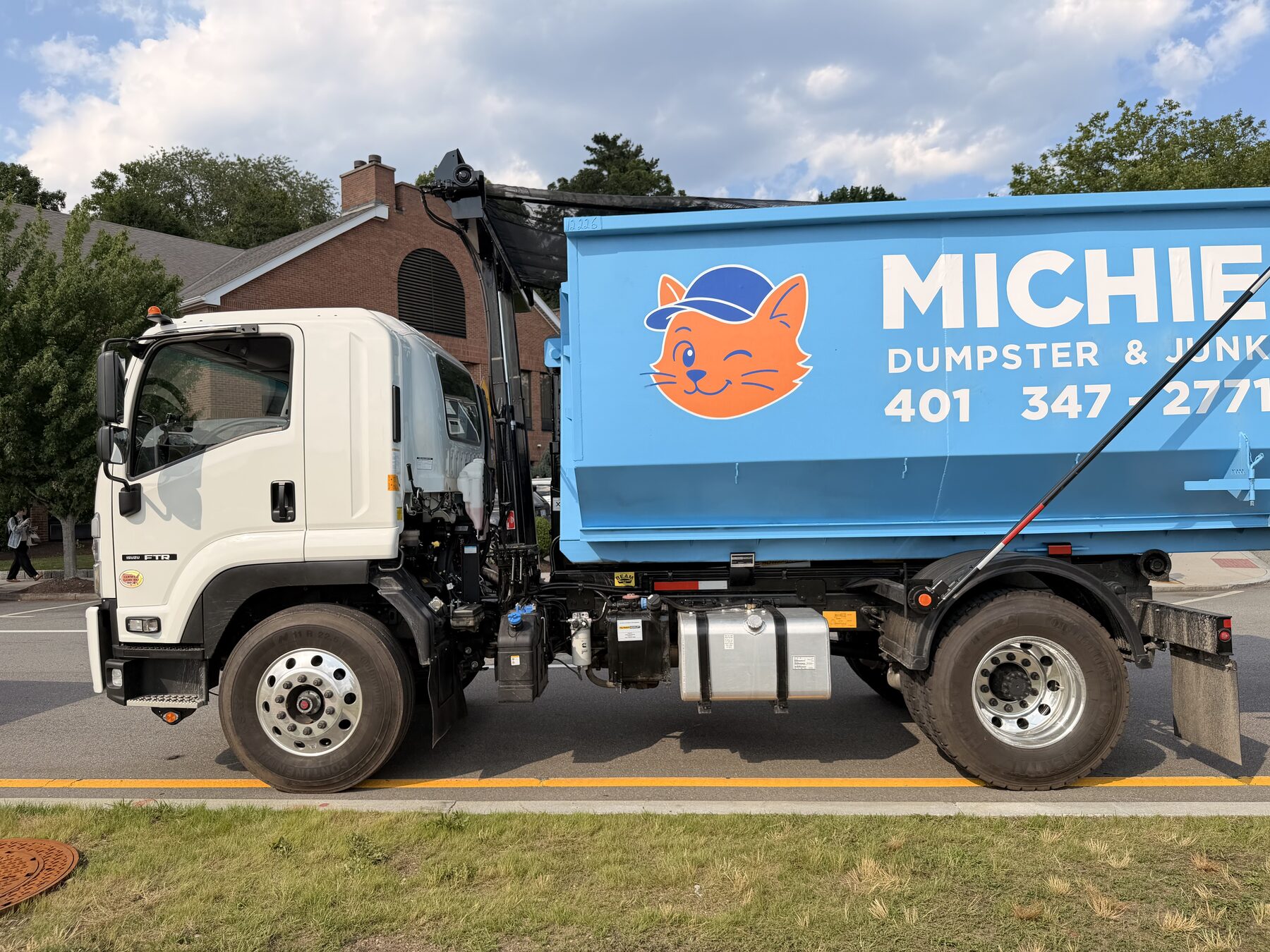 Michie Dumpster & Junk roll-off truck side view